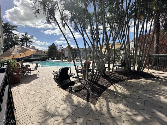 view of swimming pool featuring a patio