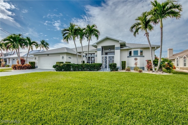 single story home featuring a front yard and a garage