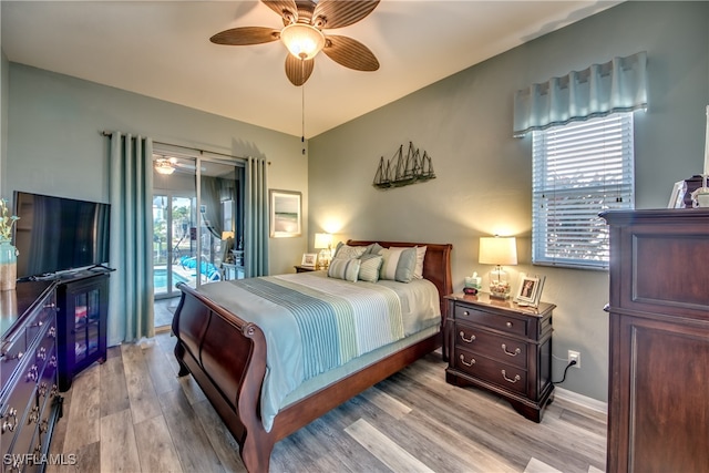 bedroom featuring access to exterior, ceiling fan, and light hardwood / wood-style floors