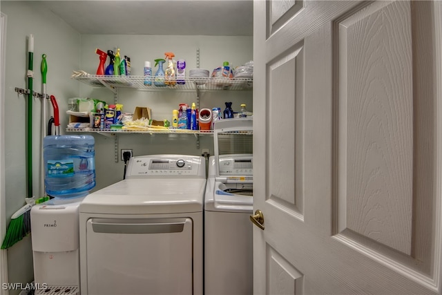 washroom with washing machine and clothes dryer