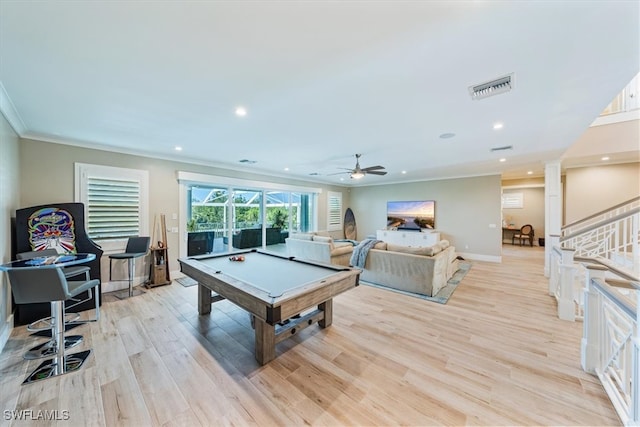 game room with light wood-type flooring, ceiling fan, ornamental molding, and billiards