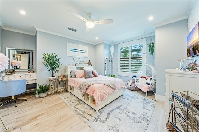 bedroom featuring light hardwood / wood-style floors, ceiling fan, and ornamental molding