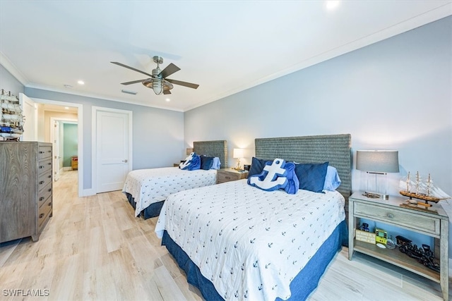 bedroom with light hardwood / wood-style floors, ceiling fan, and ornamental molding