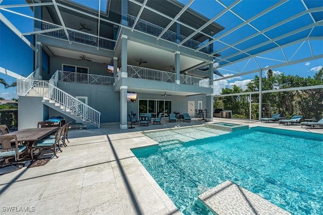 view of pool featuring an in ground hot tub and a patio area