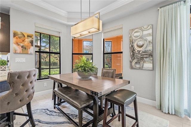 dining room with crown molding and a wealth of natural light