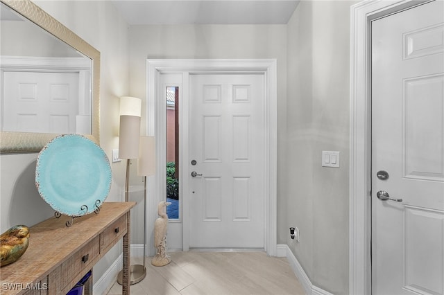 foyer entrance with light hardwood / wood-style flooring