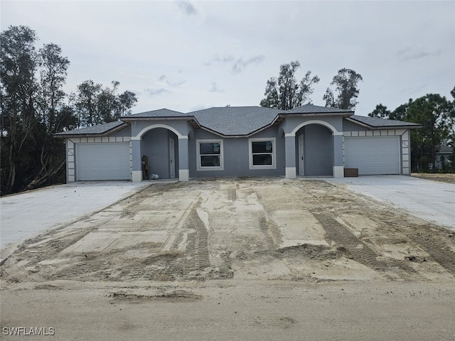 single story home featuring a garage