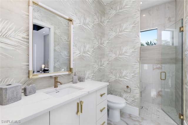 bathroom featuring vanity, a shower with shower door, toilet, and tile walls