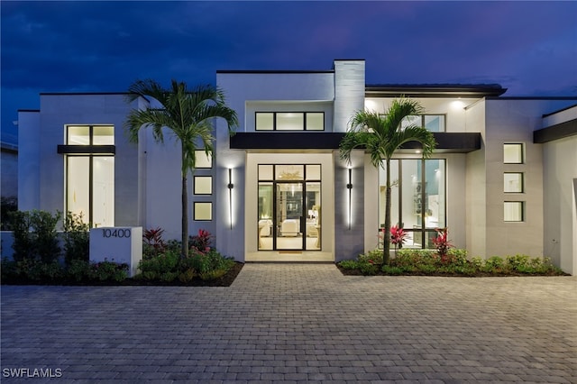 exterior entry at twilight with french doors