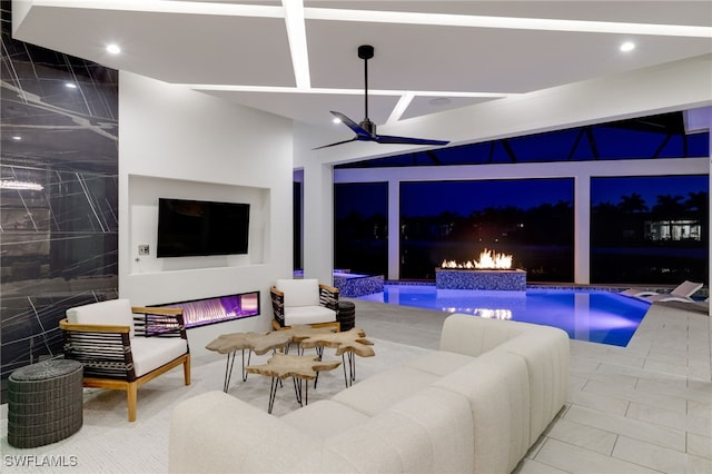 interior space featuring ceiling fan and outdoor lounge area