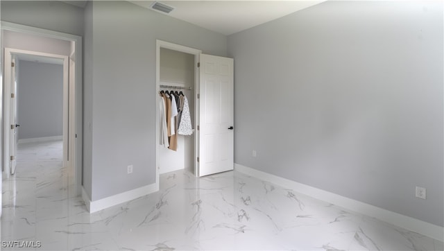 unfurnished bedroom featuring a closet