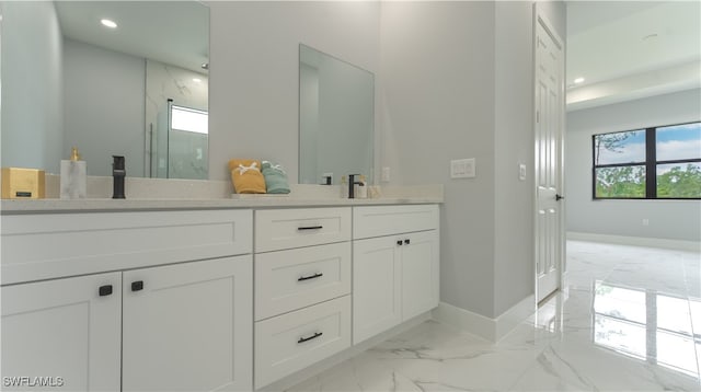 bathroom with vanity and walk in shower