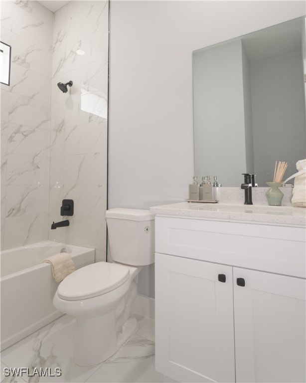 full bathroom featuring vanity, tiled shower / bath combo, and toilet