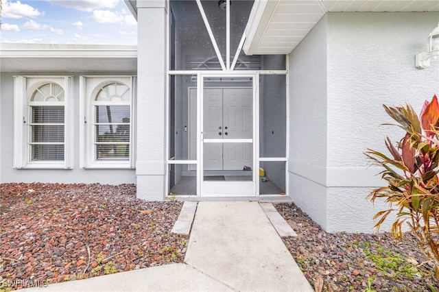 300 Morse Plz, Fort Myers, FL 33905 - doorway to property featuring stucco siding