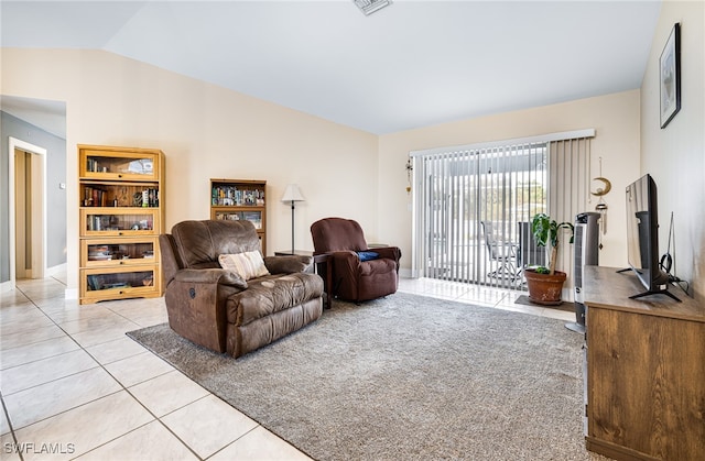 tiled living room with lofted ceiling