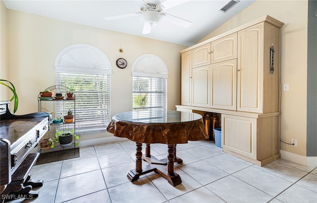 miscellaneous room featuring lofted ceiling, ceiling fan, and light tile patterned floors