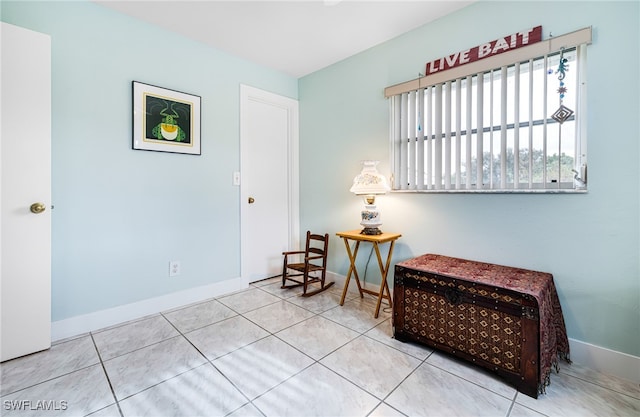 sitting room with light tile patterned floors