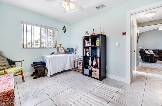 interior space featuring ceiling fan