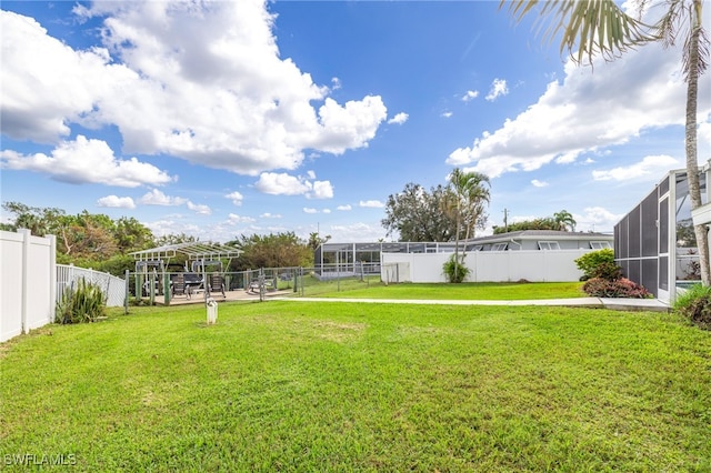 view of yard featuring a lanai