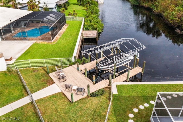300 Morse Plz, Fort Myers, FL 33905 - dock area featuring a lawn, boat lift, a fenced in pool, a fenced backyard, and a water view