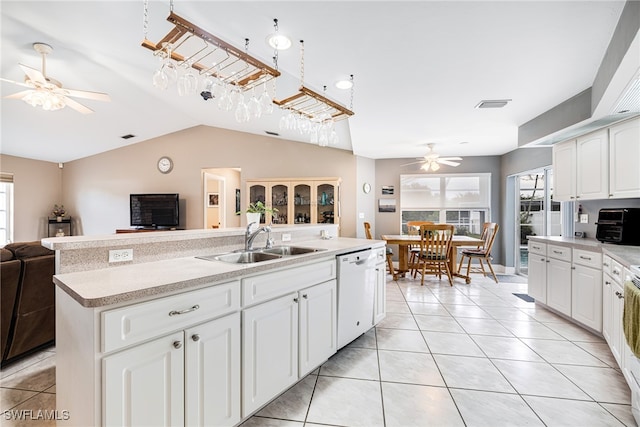 kitchen featuring sink, white cabinetry, dishwasher, and an island with sink