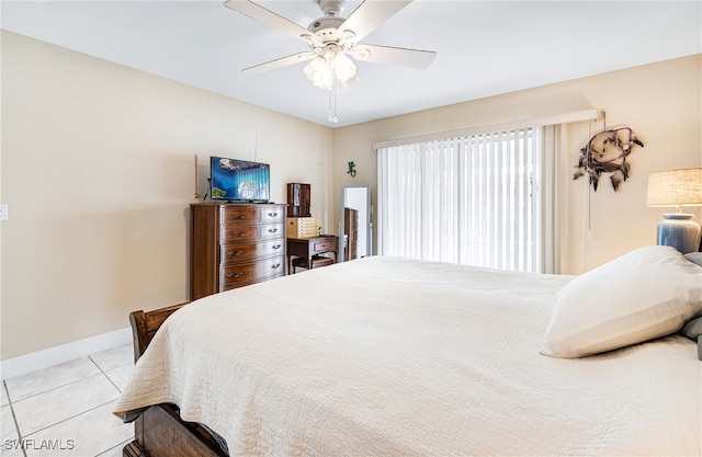 tiled bedroom with ceiling fan