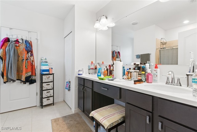 bathroom with vanity, a shower with shower curtain, and tile patterned flooring