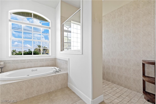 bathroom with independent shower and bath and tile patterned floors