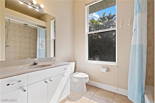 full bathroom with vanity, shower / bath combination with curtain, toilet, and tile patterned floors