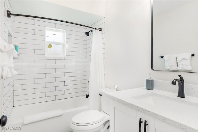 full bathroom featuring vanity, shower / bath combination with curtain, and toilet