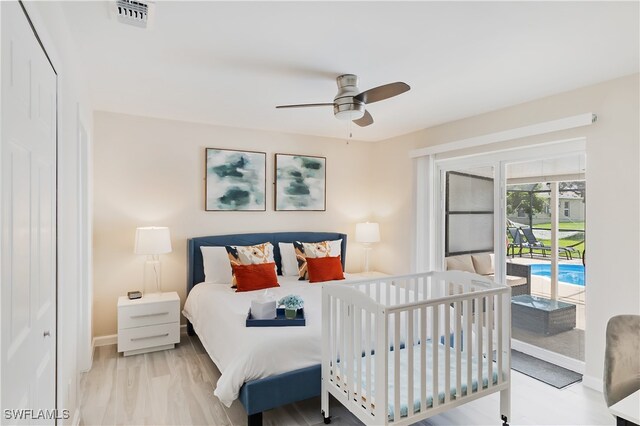 bedroom featuring ceiling fan, light wood-type flooring, a closet, and access to outside