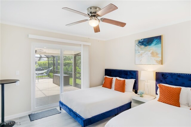 bedroom featuring light hardwood / wood-style flooring, access to exterior, and ceiling fan