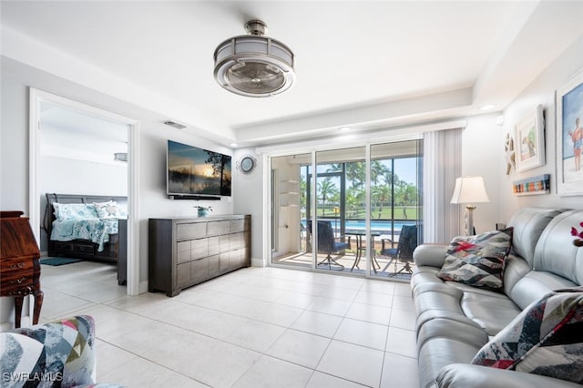 190 Pebble Beach Blvd Unit 103, Naples, FL 34113 - tiled living area featuring baseboards