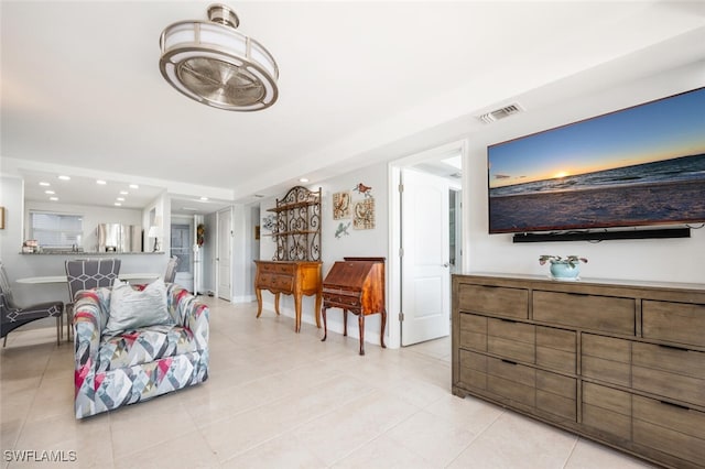 190 Pebble Beach Blvd Unit 103, Naples, FL 34113 - living room with light tile patterned floors, recessed lighting, and baseboards