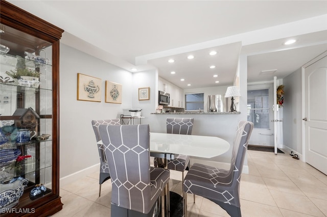 190 Pebble Beach Blvd Unit 103, Naples, FL 34113 - dining space with recessed lighting, light tile patterned floors, and baseboards