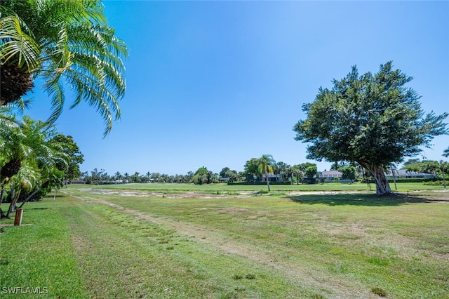 190 Pebble Beach Blvd Unit 103, Naples, FL 34113 - view of property's community with a yard