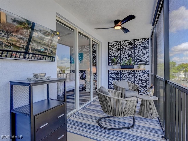 sunroom / solarium with ceiling fan