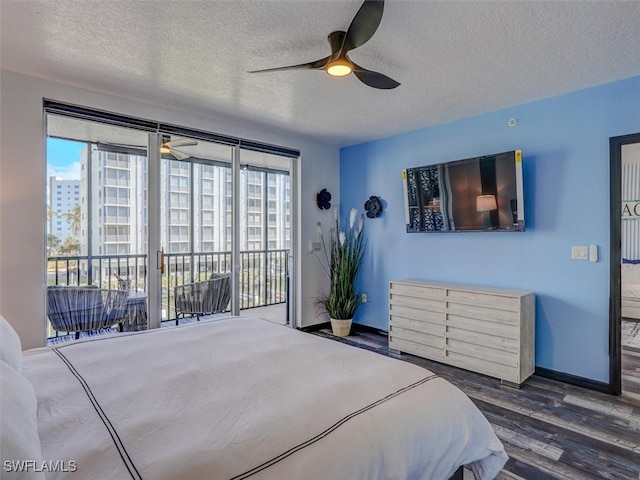 bedroom with dark hardwood / wood-style flooring, multiple windows, ceiling fan, and access to exterior