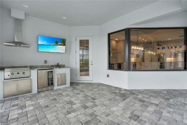 interior space with area for grilling, sink, and beverage cooler