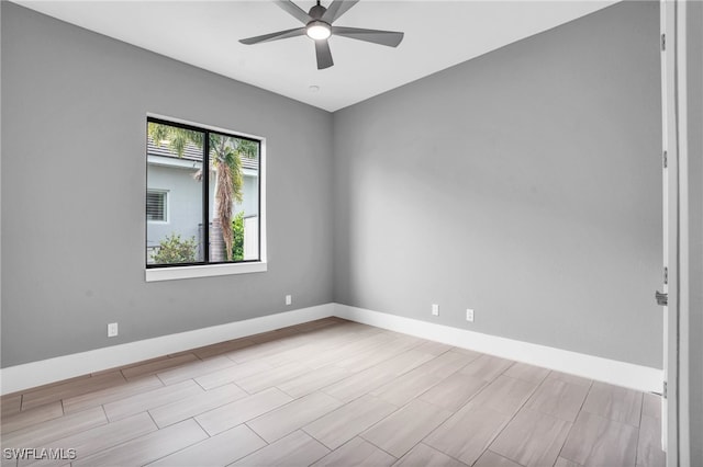 unfurnished room with light hardwood / wood-style flooring and ceiling fan