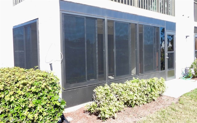 exterior space with a sunroom