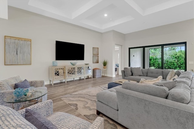 living room featuring beam ceiling, coffered ceiling, and hardwood / wood-style flooring