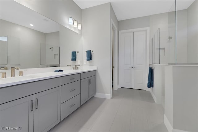 bathroom featuring vanity and a shower with shower door