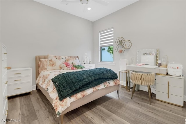 bedroom featuring light hardwood / wood-style floors and ceiling fan