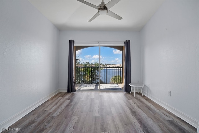 spare room with hardwood / wood-style flooring and ceiling fan