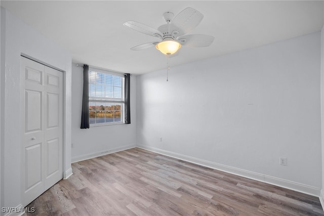 unfurnished room featuring ceiling fan and light hardwood / wood-style floors