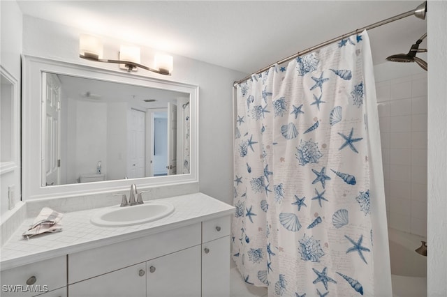 bathroom with toilet, vanity, and a shower with shower curtain