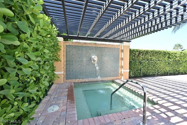 view of swimming pool featuring a pergola and an in ground hot tub