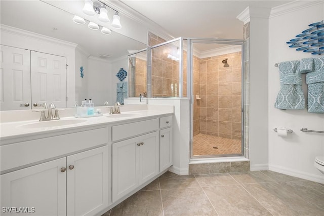 bathroom with vanity, crown molding, tile patterned flooring, toilet, and a shower with shower door