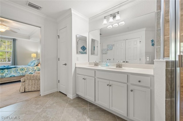 bathroom featuring tile patterned flooring, vanity, ceiling fan, and crown molding